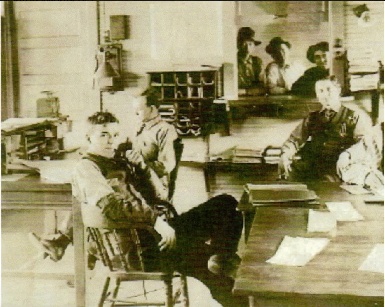 Depot staff seated at desks inside the depot office