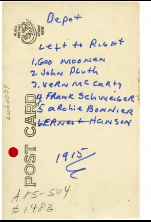 Back of the 1915 postcard with the crew's names handwritten in blue ink