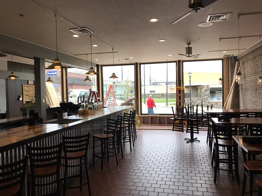 The bar and dining room with tile floor and big windows