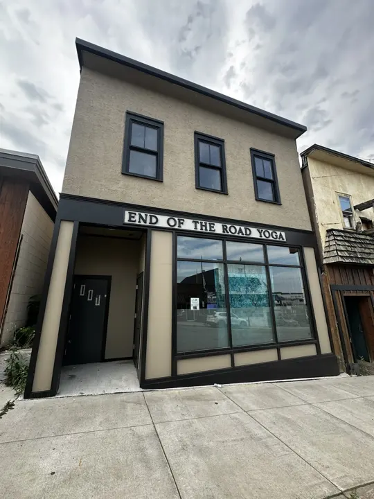 The finished storefront with an End of the Road Yoga sign